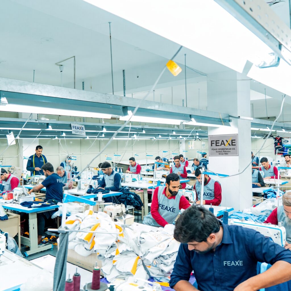 Industrial stitching line, OEM activewear production, private label sportswear manufacturer, cut and sew factory, bulk apparel assembly.